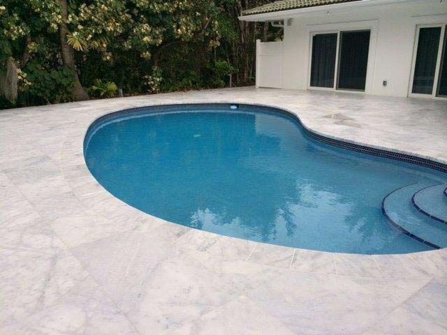 A large swimming pool with steps leading to it