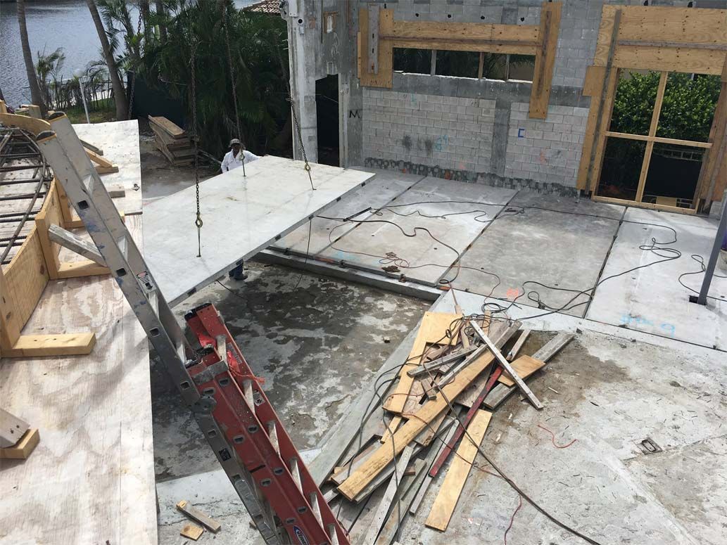 A ladder is sitting on top of a pile of concrete.