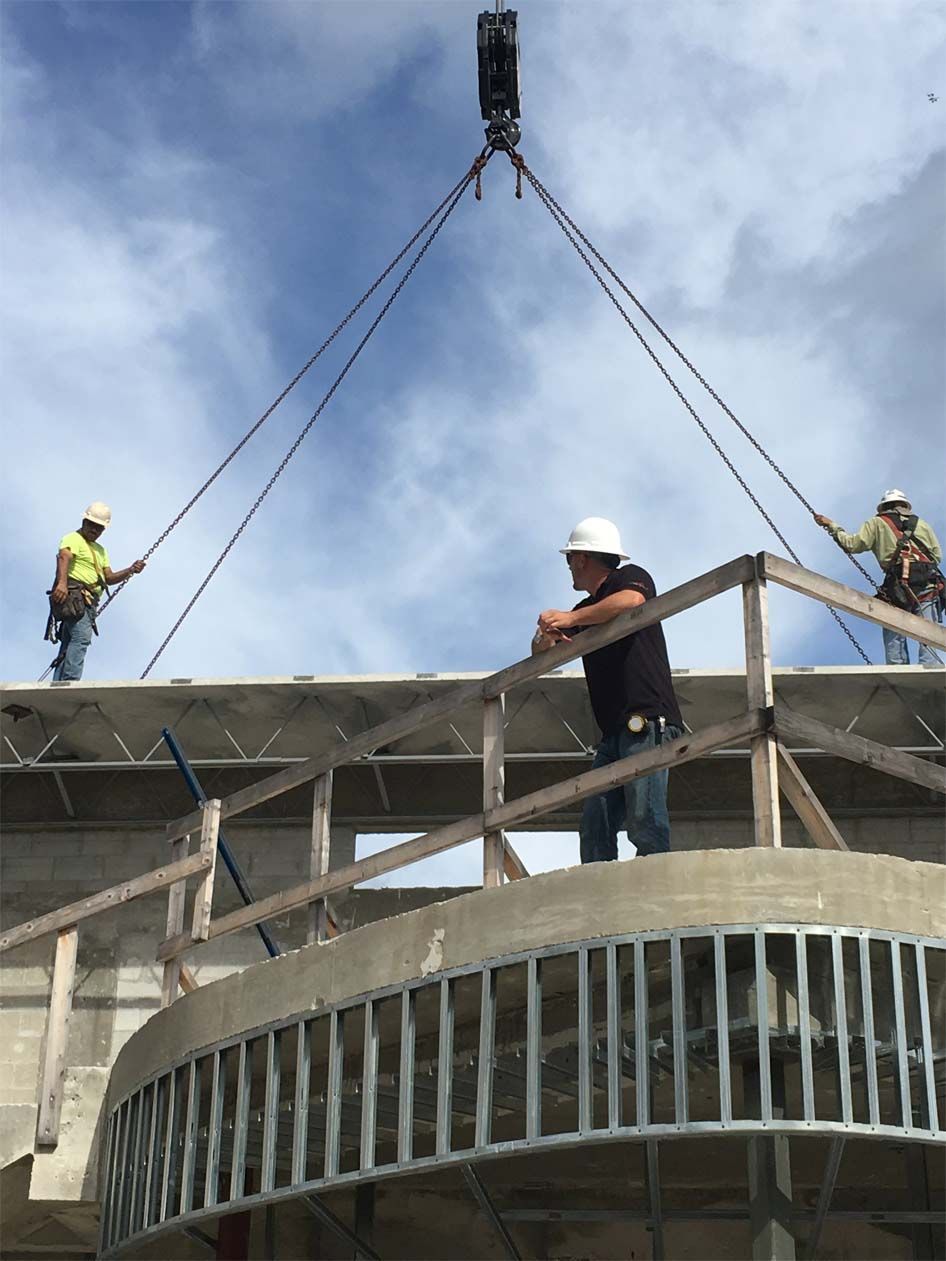 A group of construction workers are working on a building