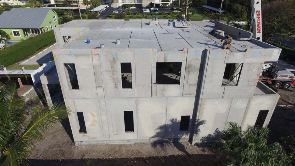 An aerial view of a large concrete building under construction