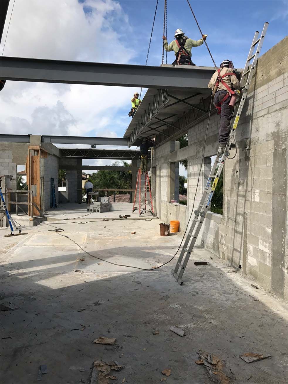 A group of construction workers are working on a building.