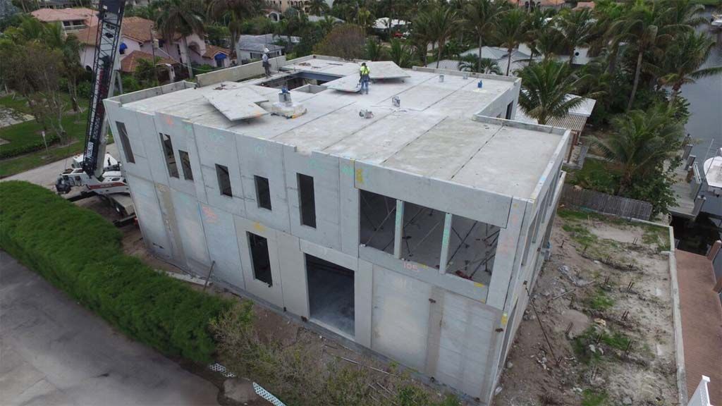 An aerial view of a large house under construction.
