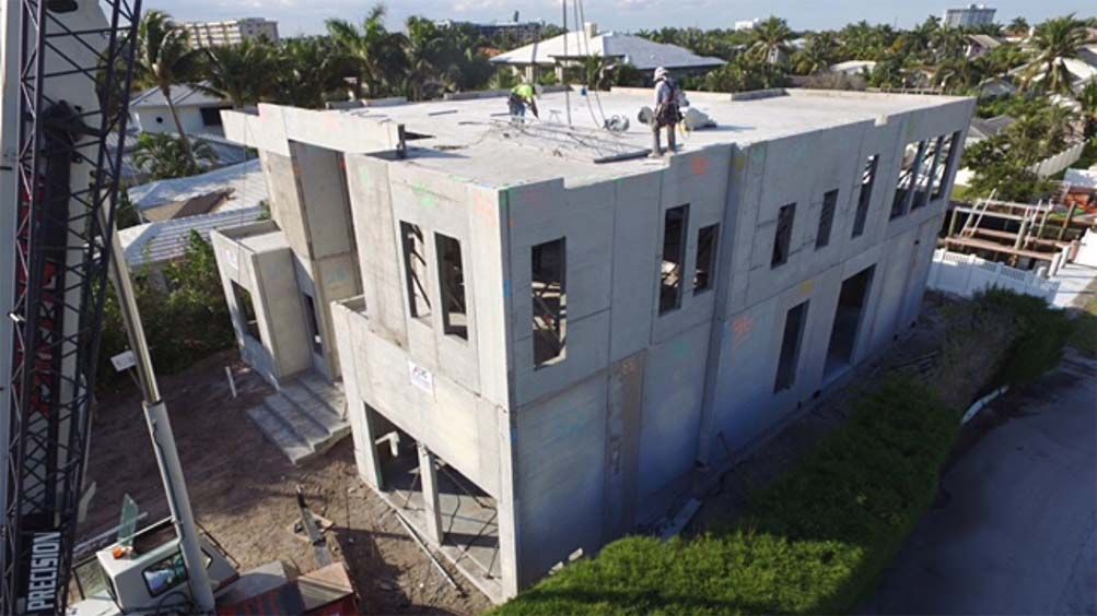An aerial view of a large building under construction.