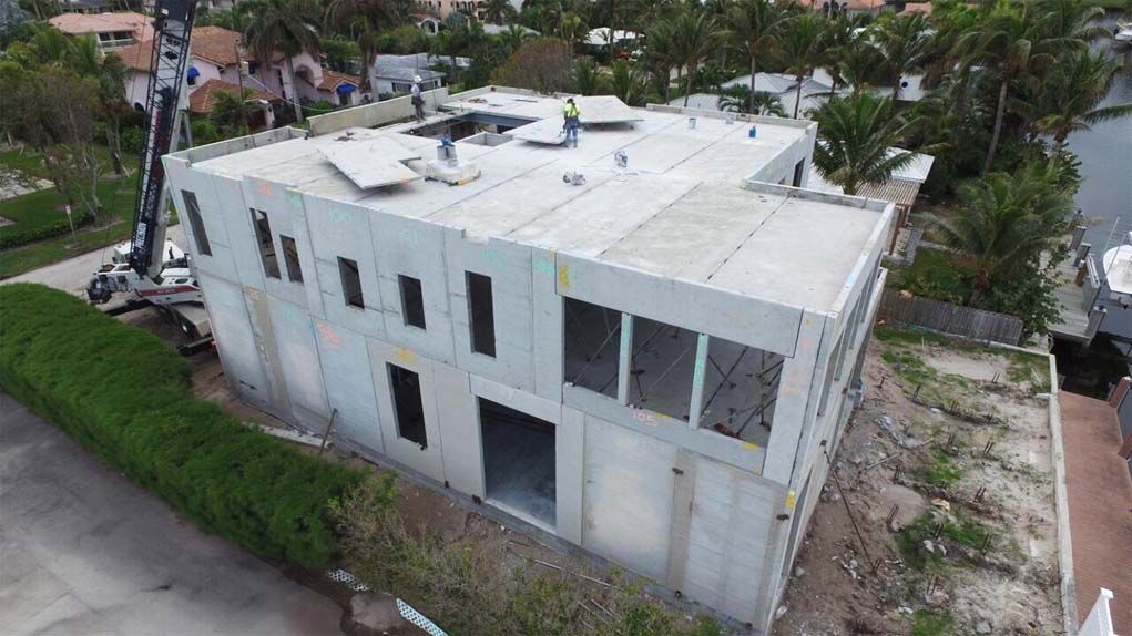 An aerial view of a large building under construction.
