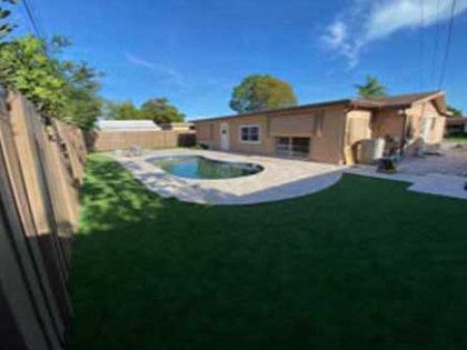 A house with a swimming pool in the backyard.