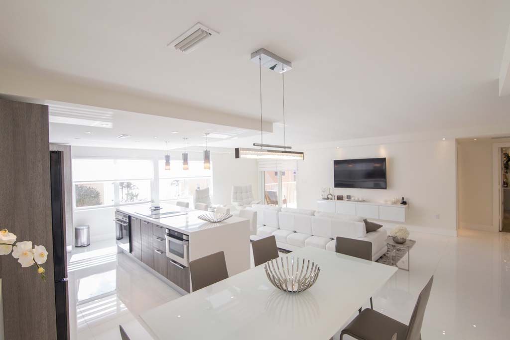 There is a dining table in the middle of the room.