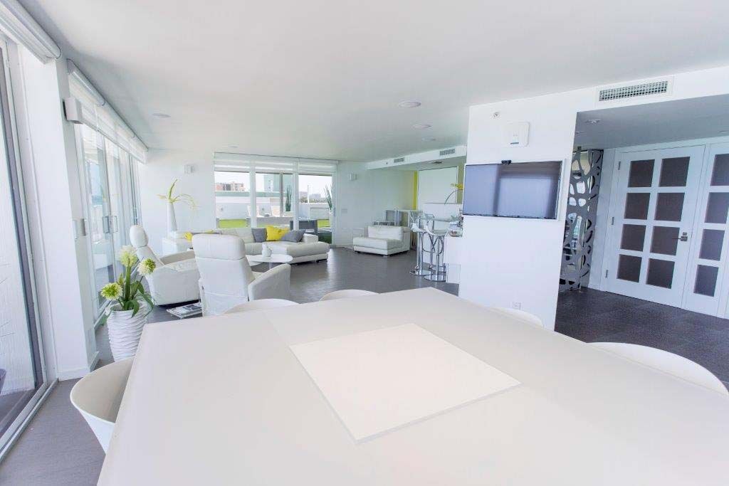 There is a large table in the middle of the room.