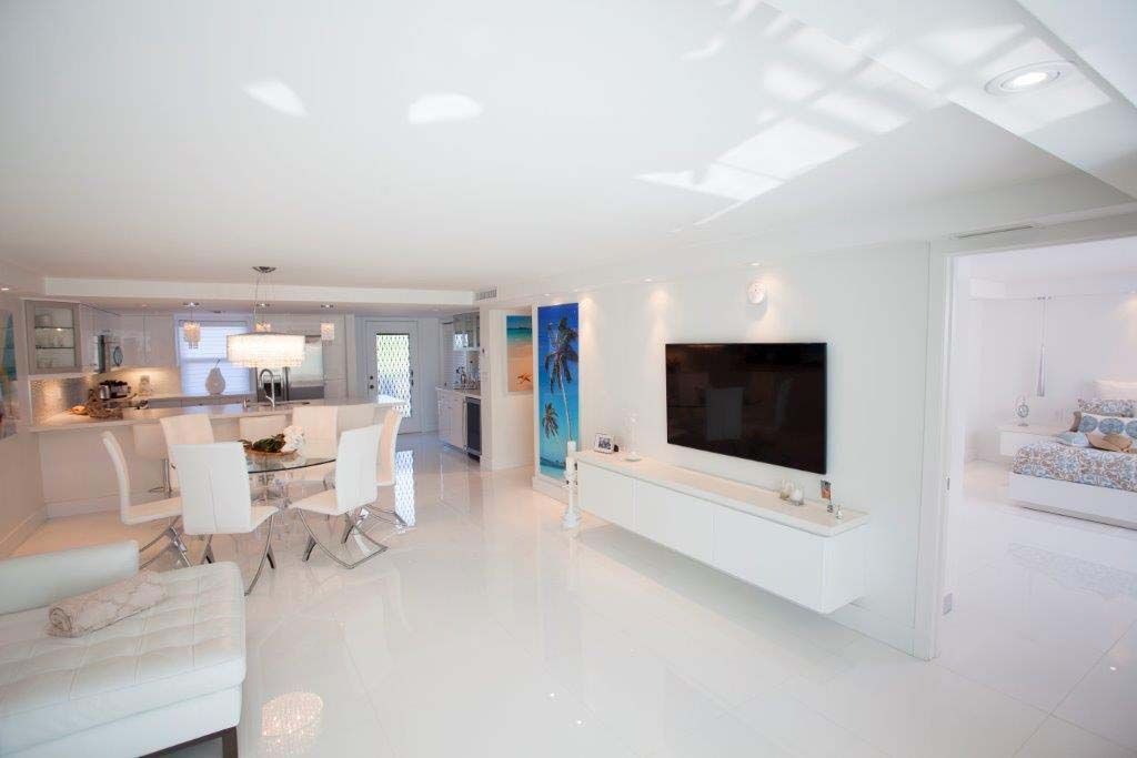 A living room filled with furniture and a flat screen tv.