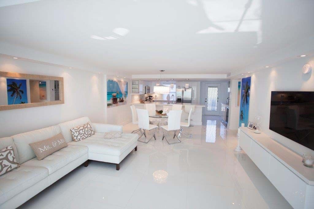 A living room filled with furniture and a flat screen tv.