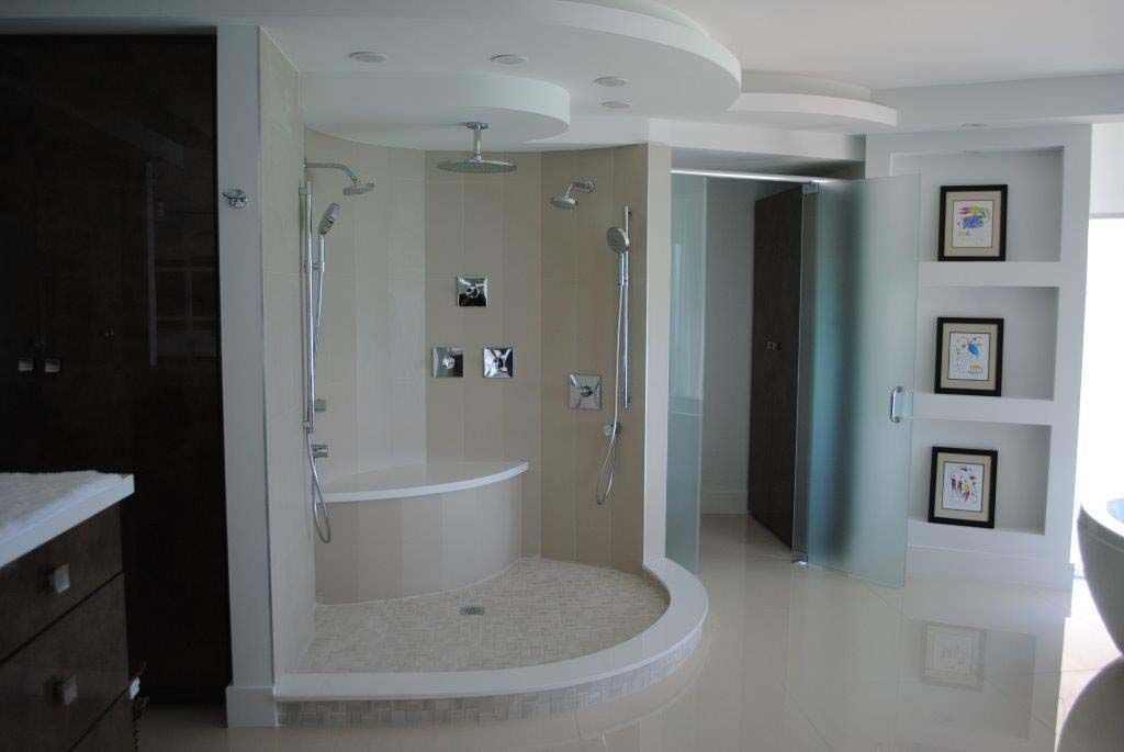 A bathroom with a walk in shower and a bathtub