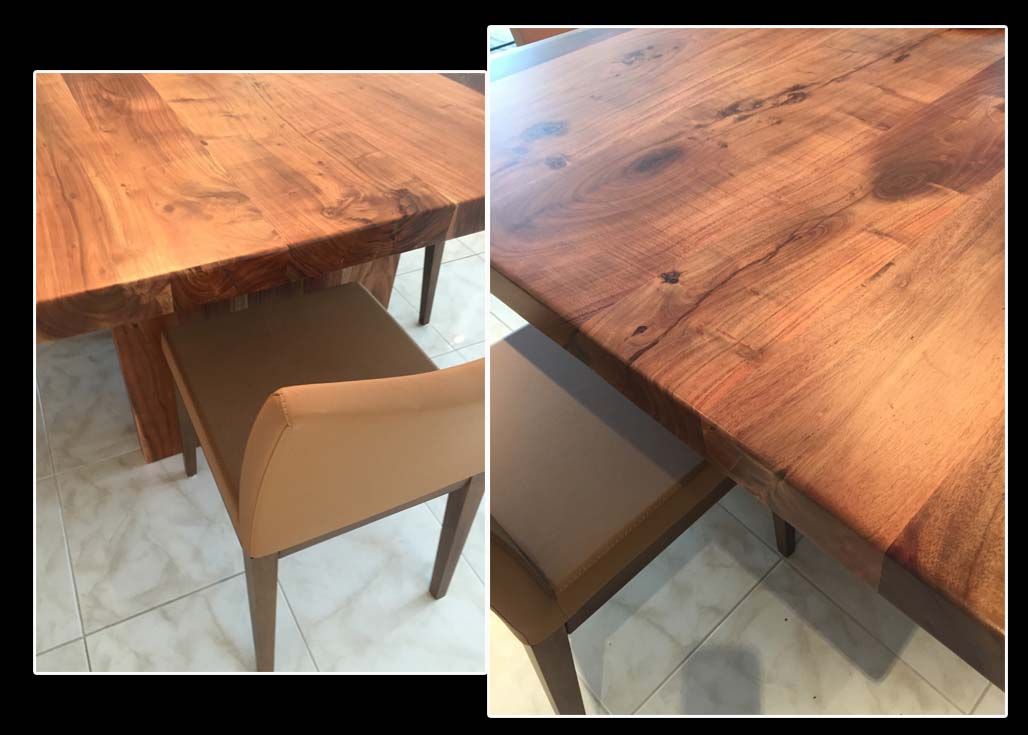 A wooden table with a chair underneath it