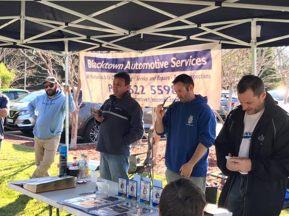 72-78 Ford V8 club NSW members having a discussion