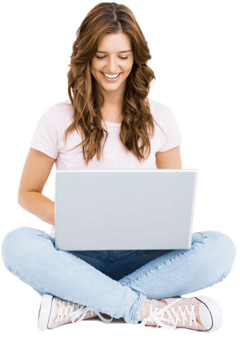 A woman is sitting on the floor using a laptop computer