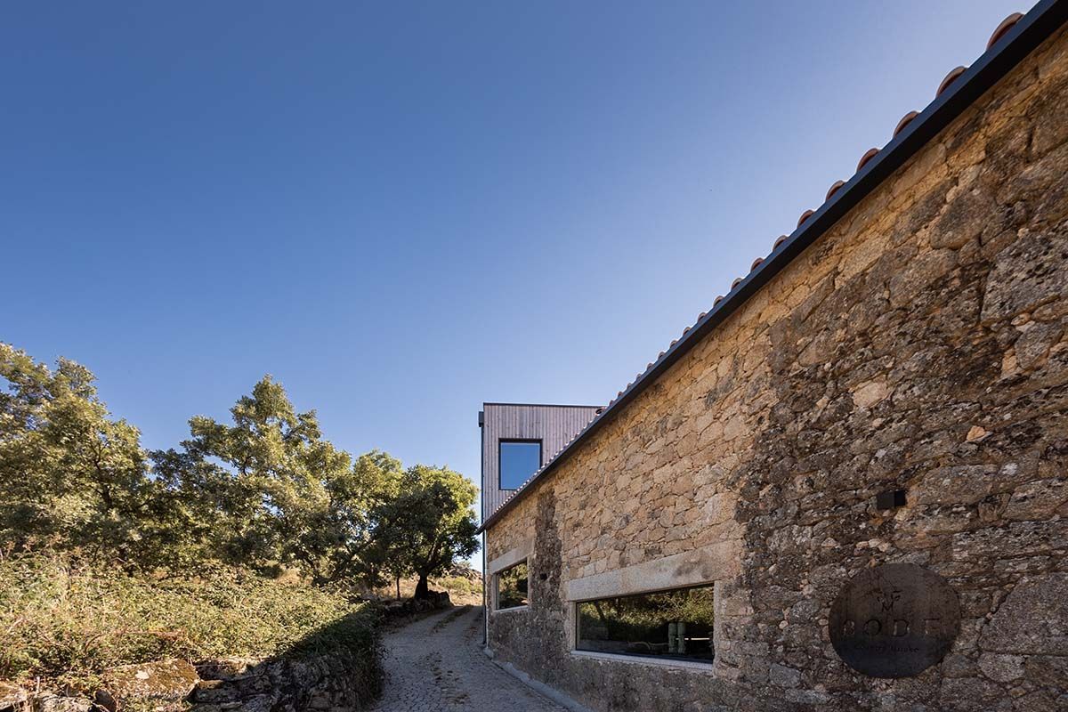 A stone building with a window on the side of it