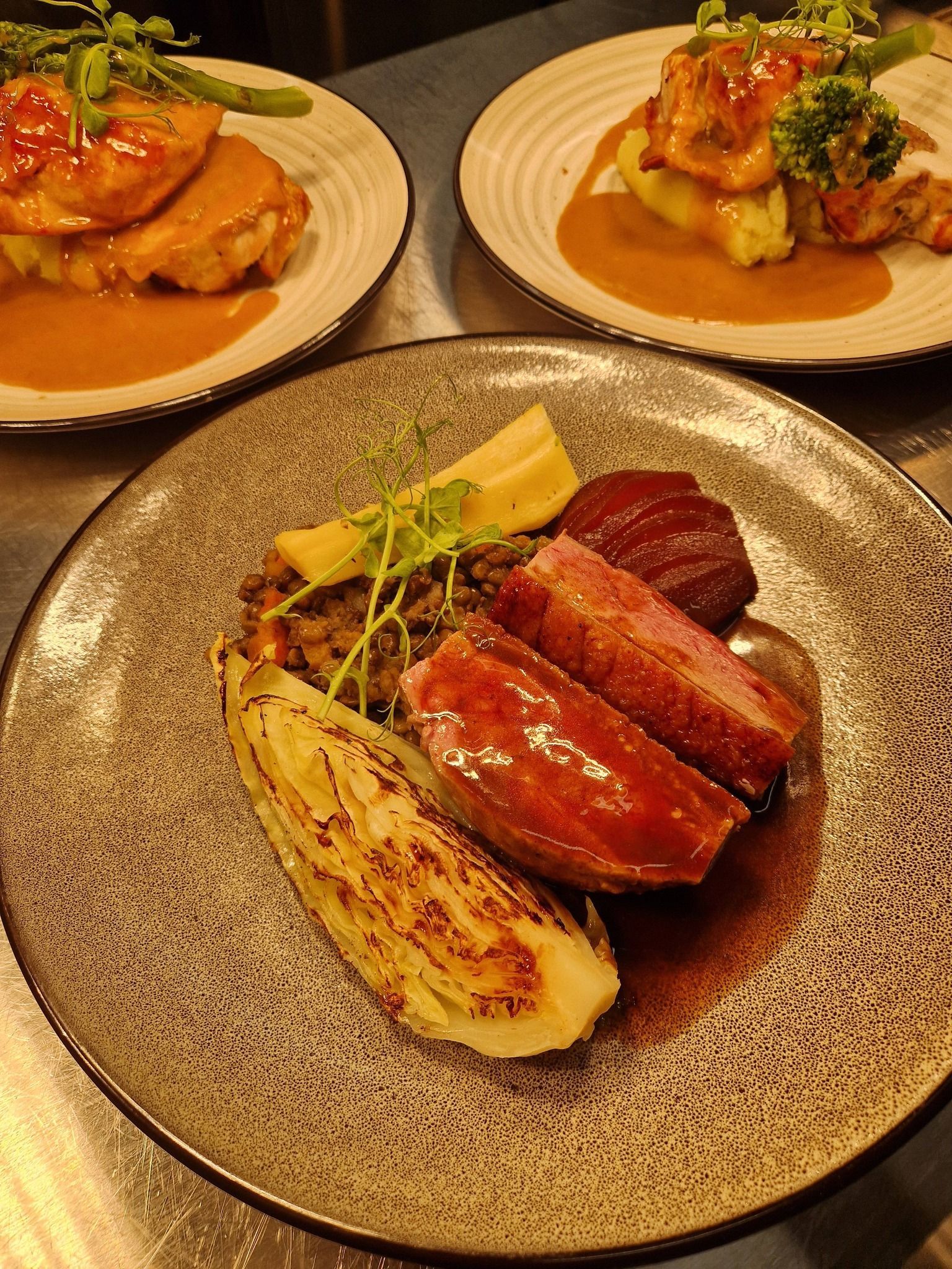 The new Sunday lunch menu at The Station Hotel Insch for 2026 showing three different food dishes