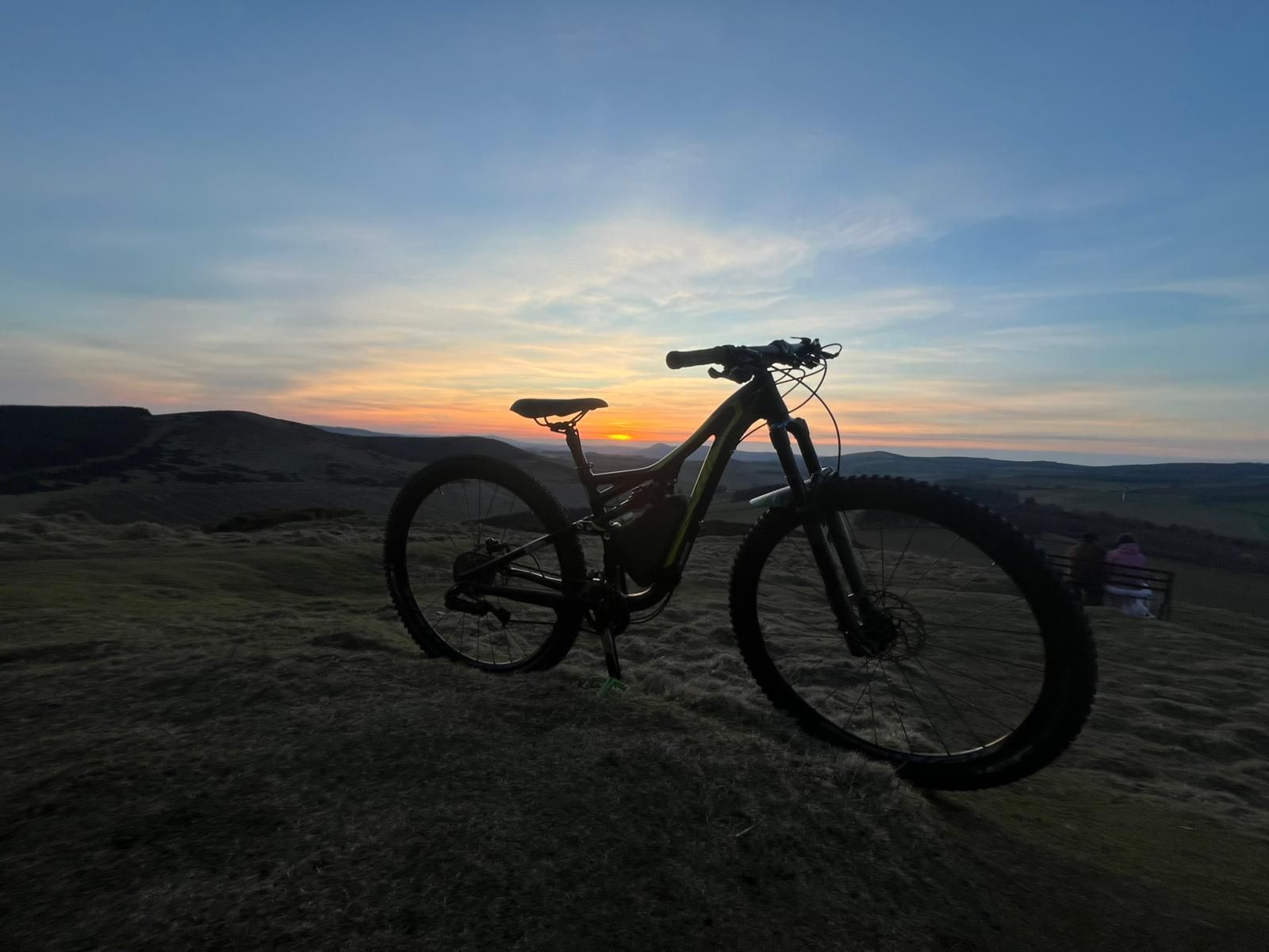 A mountain bike sits as the sun goes down over Insch