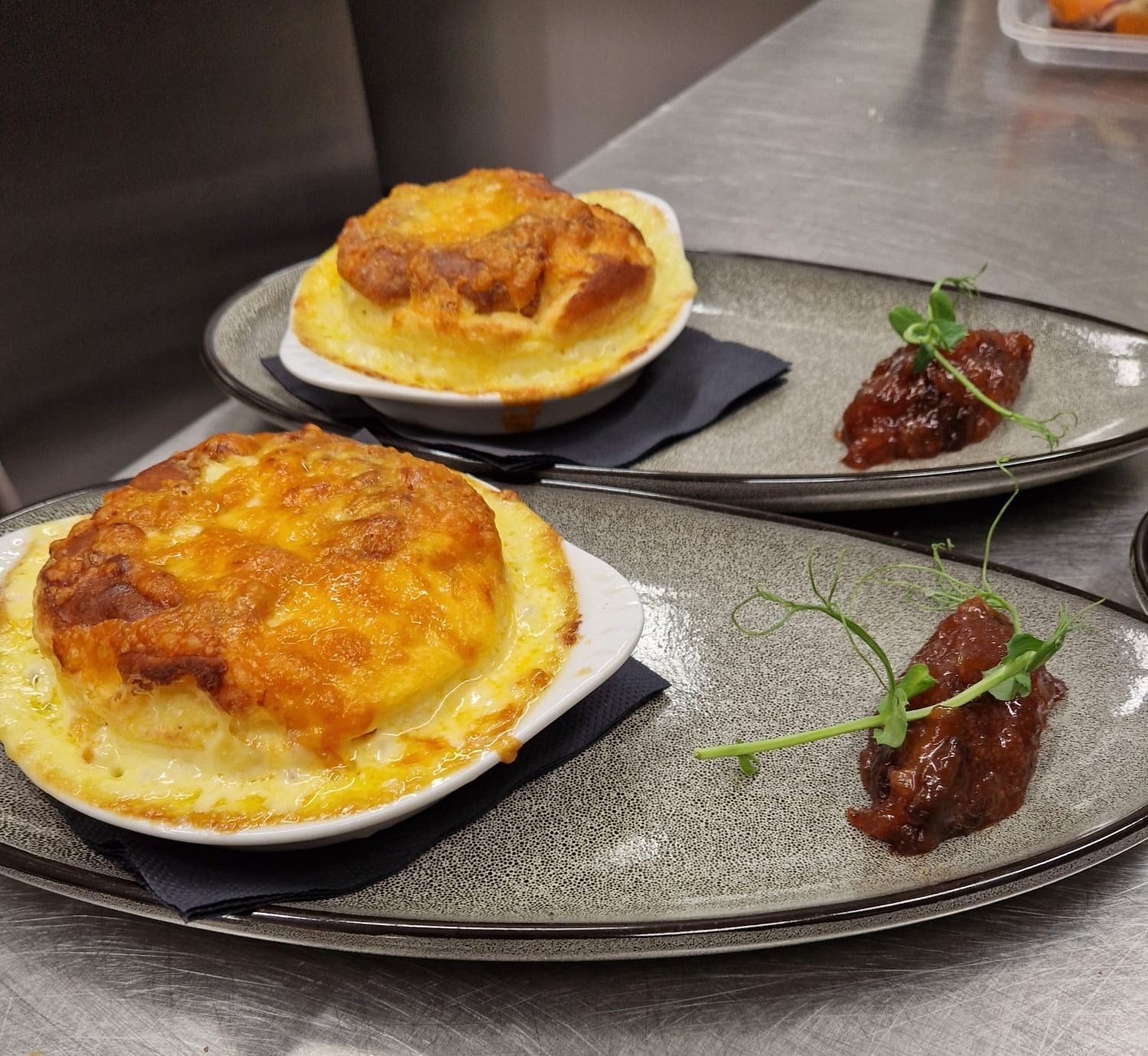 A plate with a Cheese Soufflé with Apple Chutney