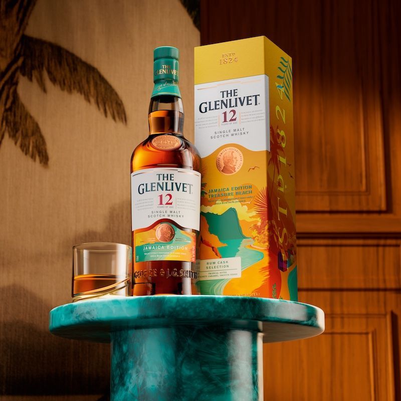 The Glenlivet Jamaica rum cask whisky selection bottle and packaging sitting on a table with a glass of the whisky