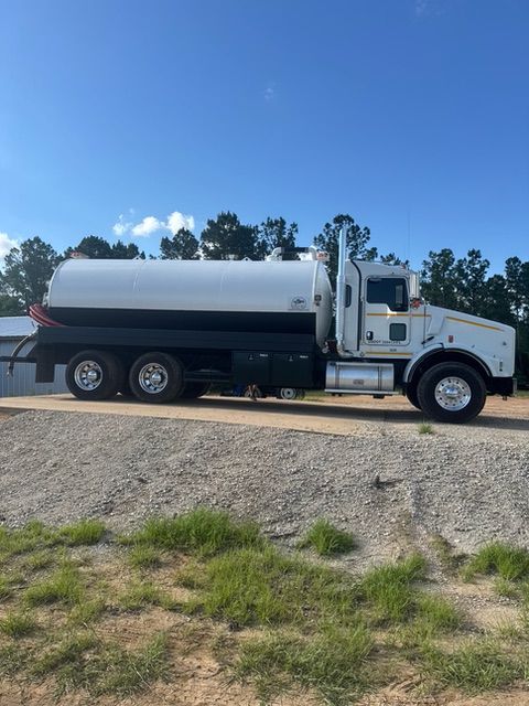 A white truck is parked on the side of the road