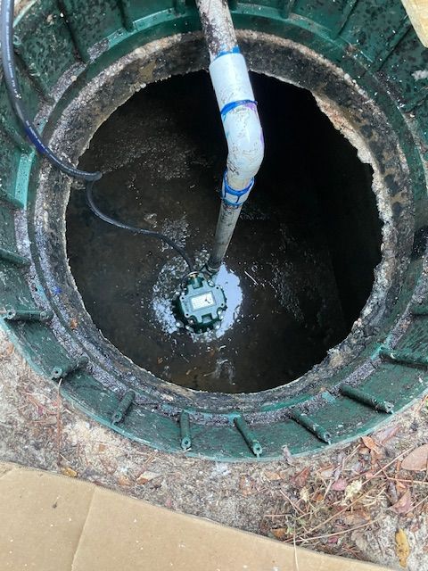 A tanker truck is parked on the side of the road.