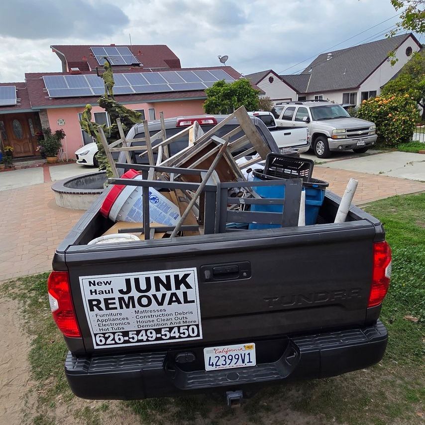 A truck with a sticker on the back that says junk removal