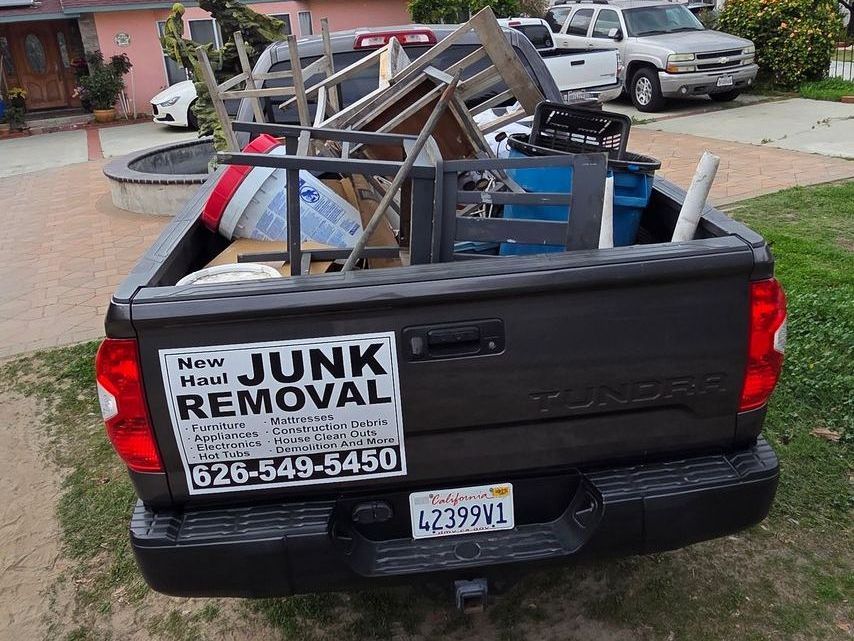 A truck with a sticker on the back that says junk removal