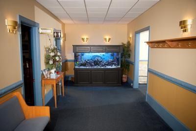 A hallway with a large aquarium in the middle