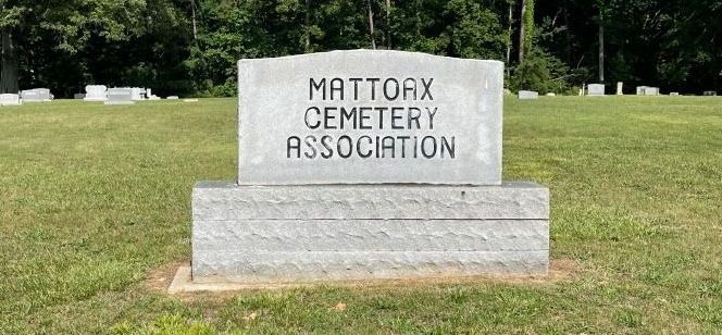 A gravestone in a cemetery with the words mattox cemetery association written on it.