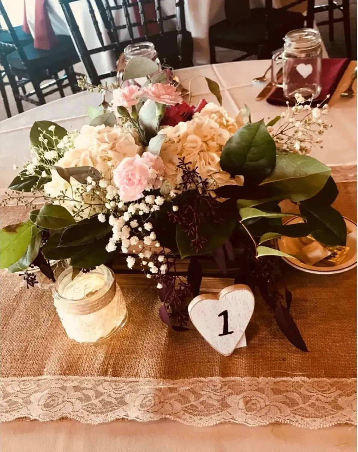 A table with flowers and a heart with the number 1 on it