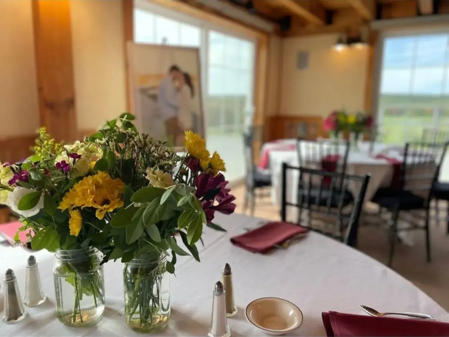 A table with a vase of flowers on it