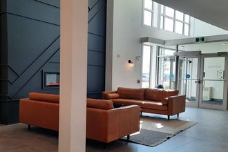 Arbutus Community Shared Space showcasing the new feature wall, fireplace, and seating area near the entrance.