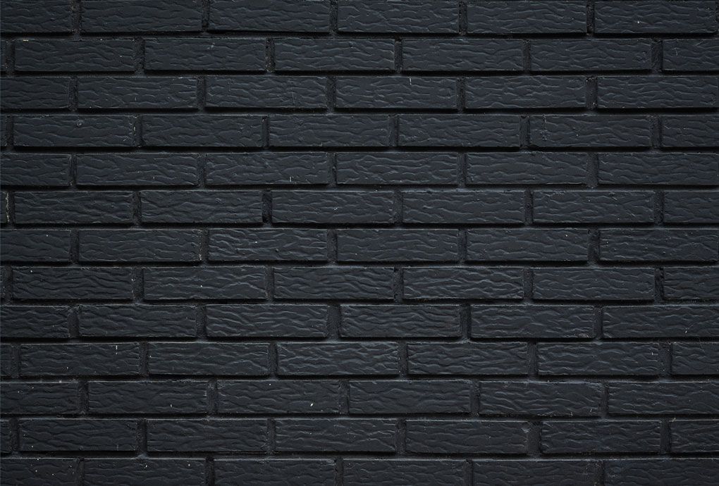 Black painted brick and masonry walls
