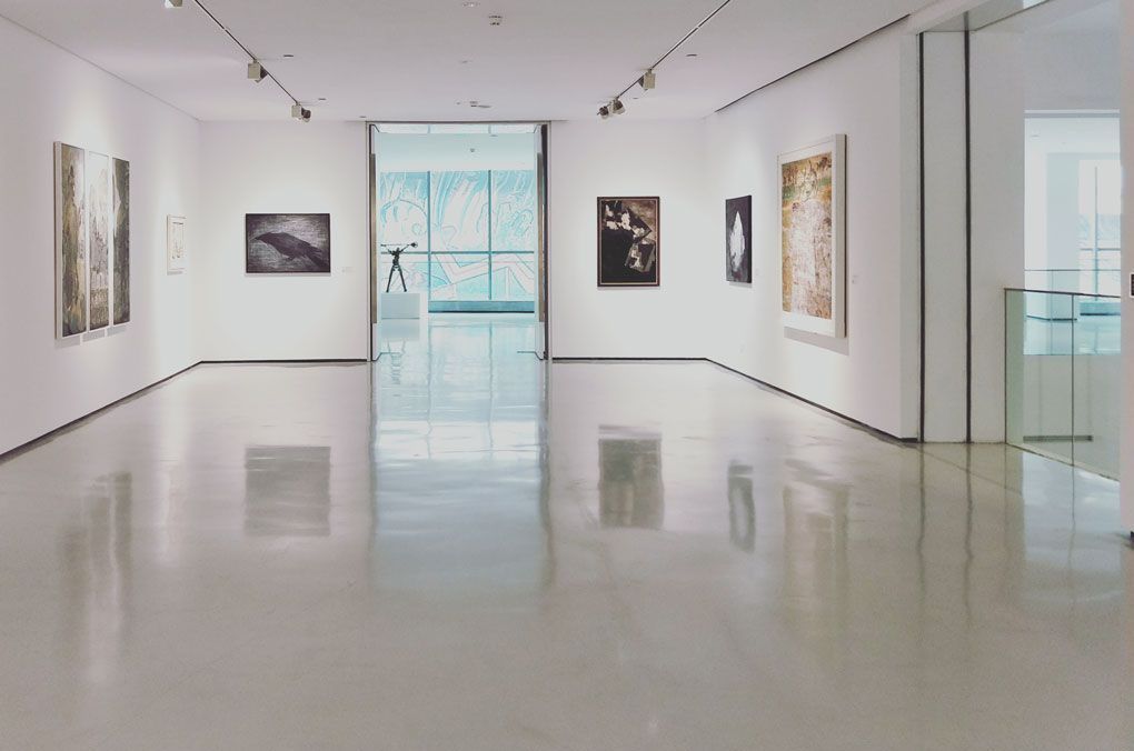 Open gallery space with epoxy and acrylic coated floors