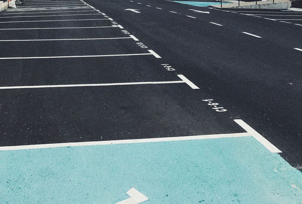 Freshly painted safety lines on dark pavement