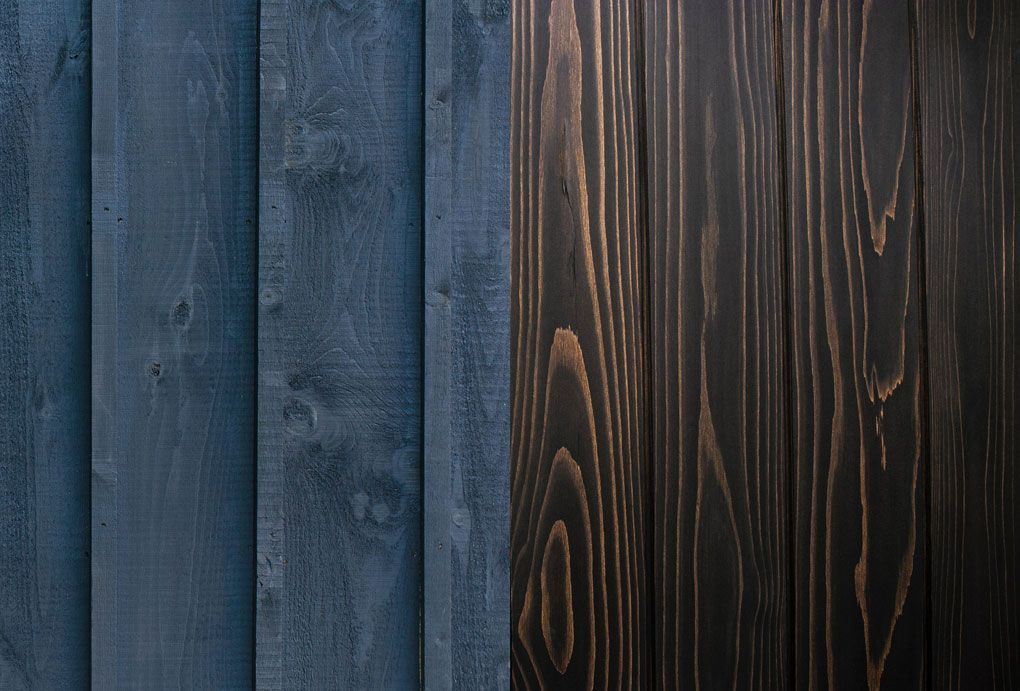 Two varieties of re-stained cedar shakes, one in navy blue and the other in a natural rich oak hue.