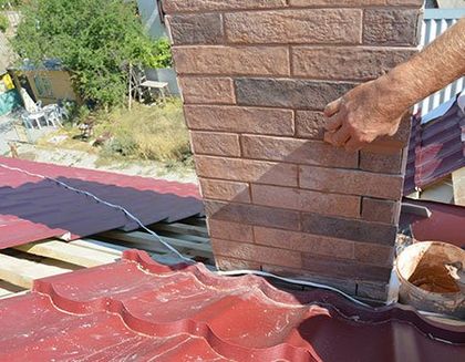 Worker Restoring Chimney — Apollo, PA — T. D. Brick Pointing, LLC