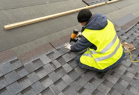 Man Installing Roof Shingles On A House — Apollo, PA — T. D. Brick Pointing, LLC