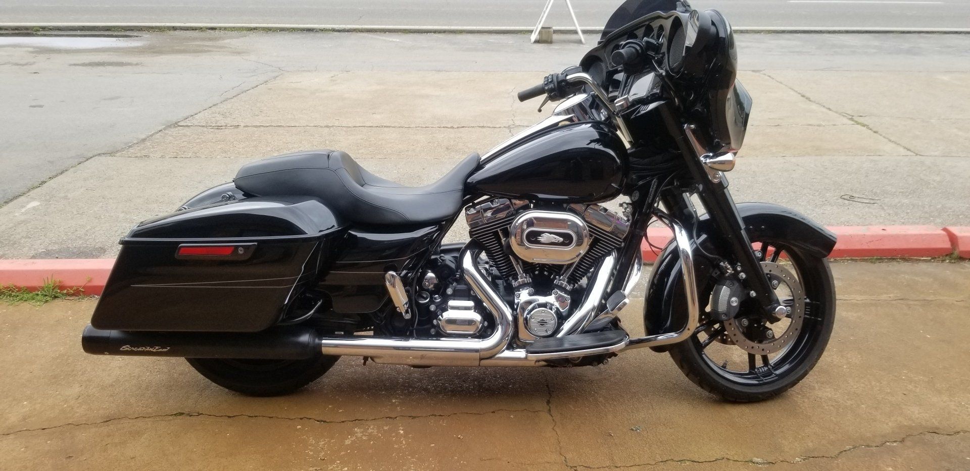 Black Harley Davidson motorcycle parked outdoors.