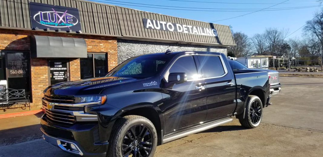 Black truck parked in front of