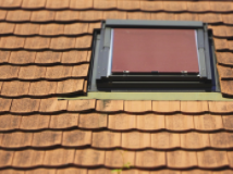 wooden roof shingles around a skylight