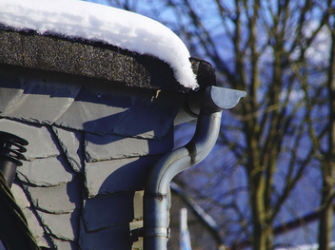 a gutter system covered in snow