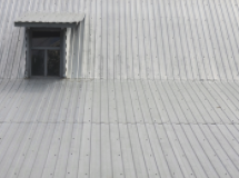 a clean aluminum roof with a window