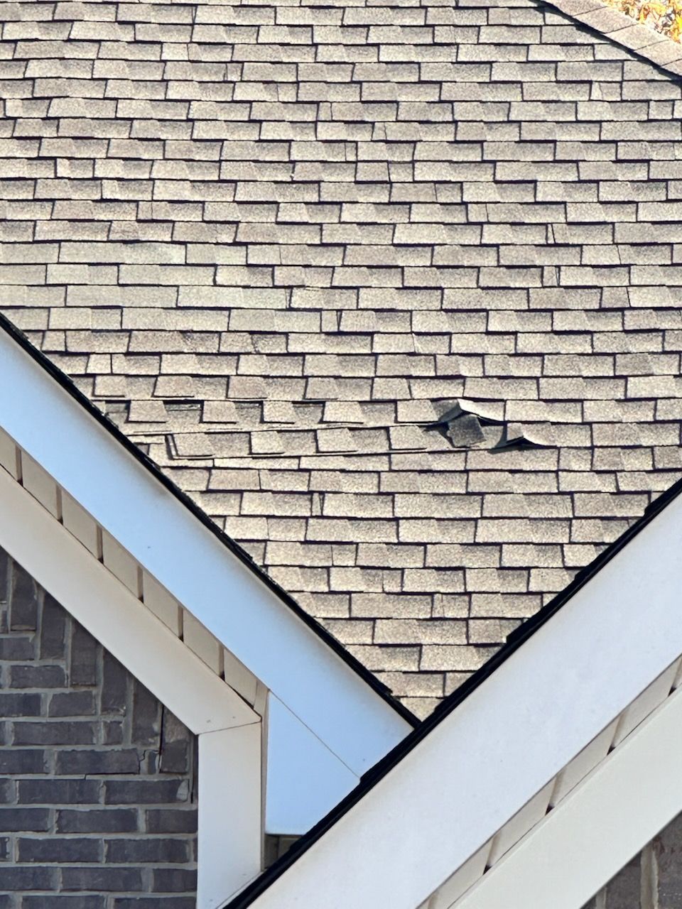 A close up of a roof with shingles on it.