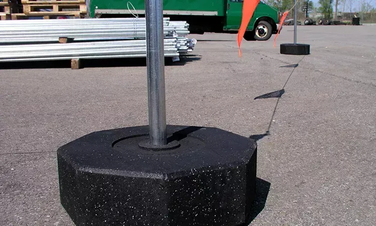 A metal pole with a rope attached to it is on a roof. A metal pole with a rope attached to it is on a roof.