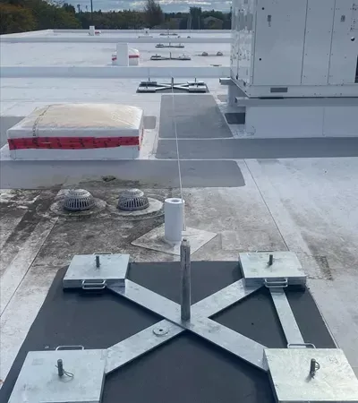 The roof of a building with a few boxes on it