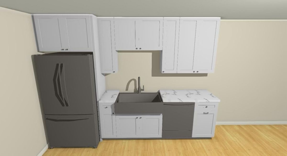A kitchen with white cabinets , a gray refrigerator , a sink , and a wooden floor.