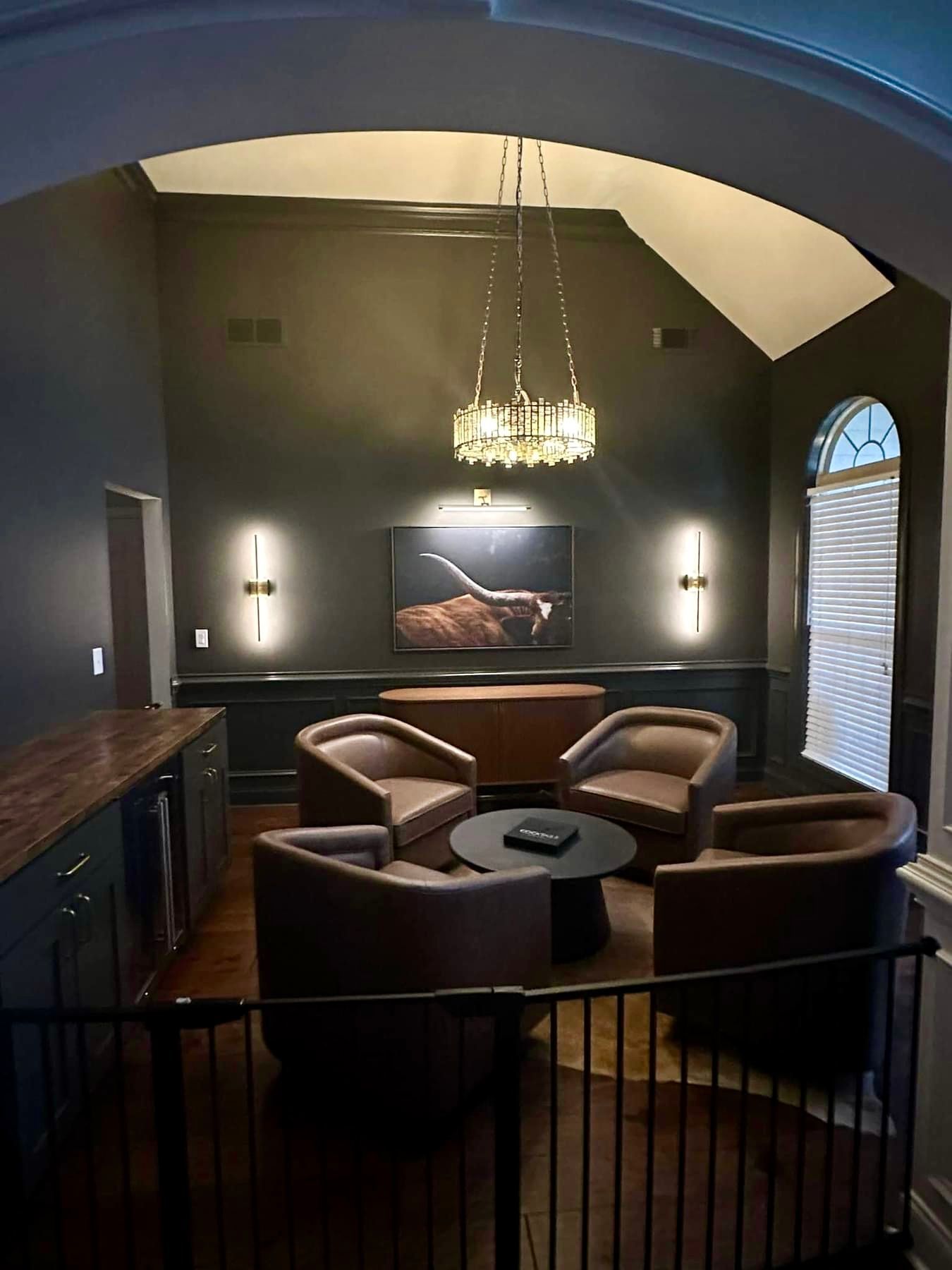 A living room filled with furniture and a chandelier.