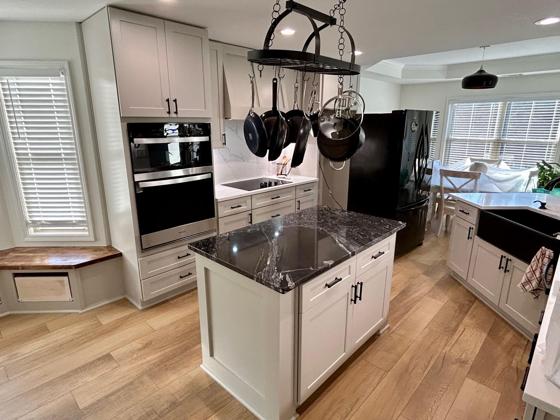 A kitchen with a large island in the middle of the room.