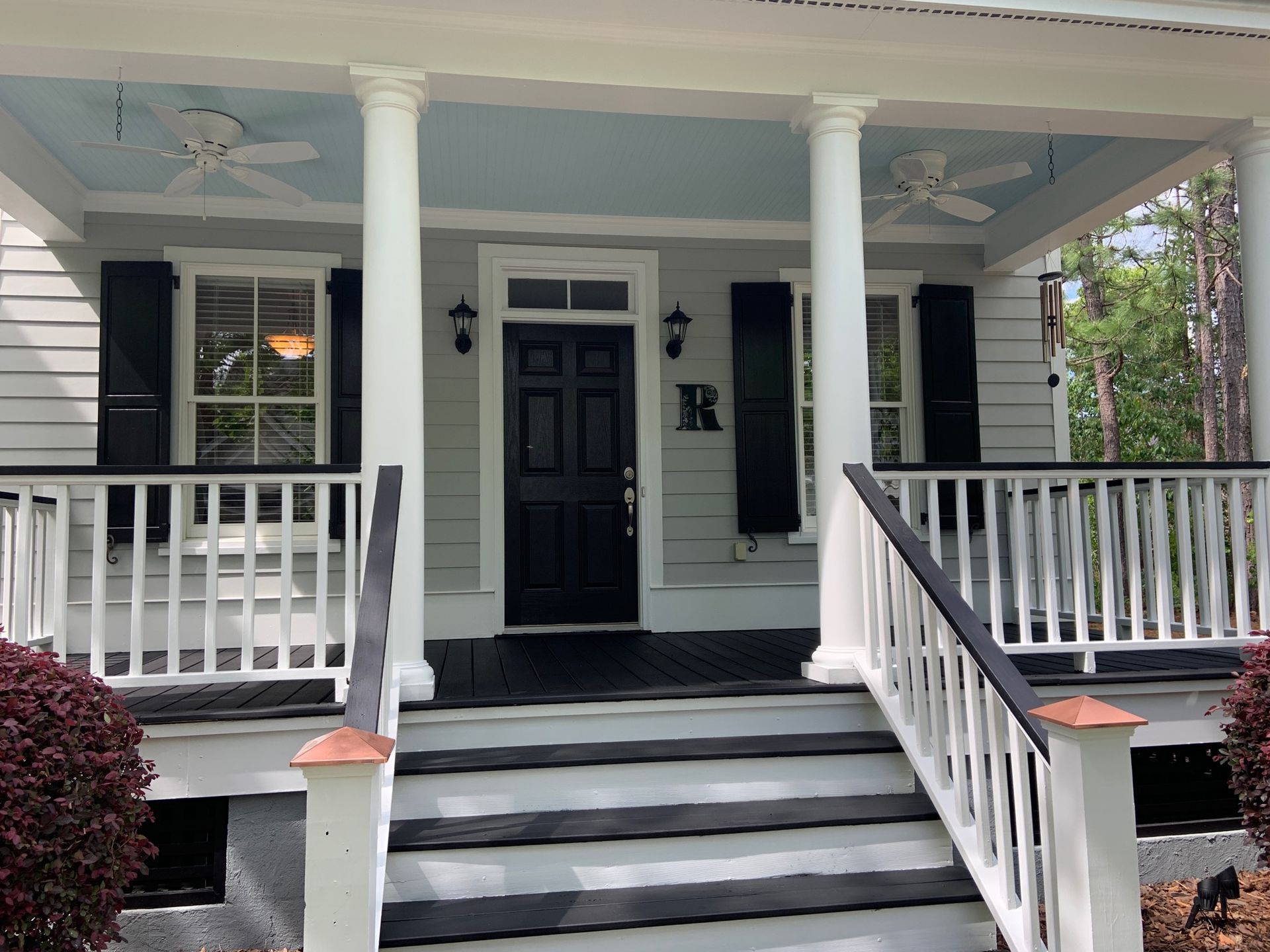 The front of a house with a porch and stairs