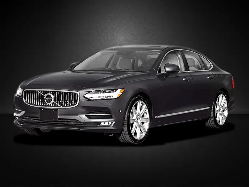 A black volvo s90 is parked on a black background.